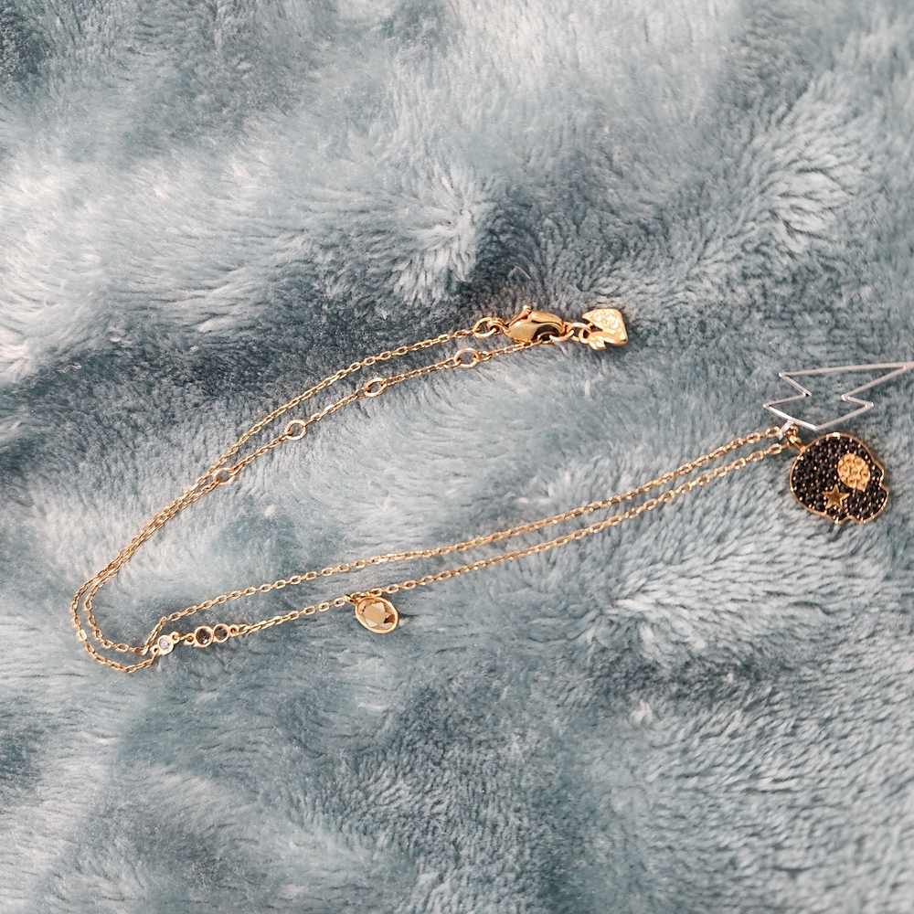 Elegant Gold Necklace with Black Pendant